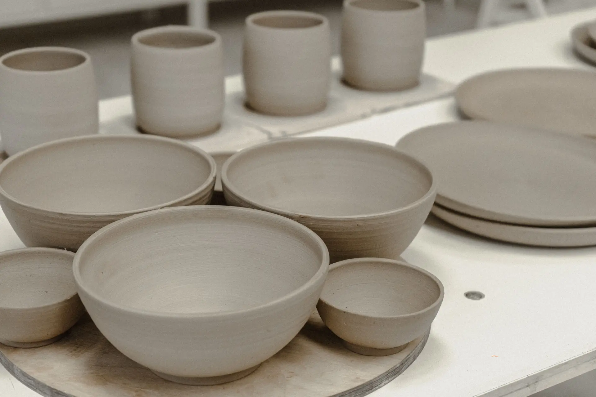Pottery workshop with handmade mugs and bowls