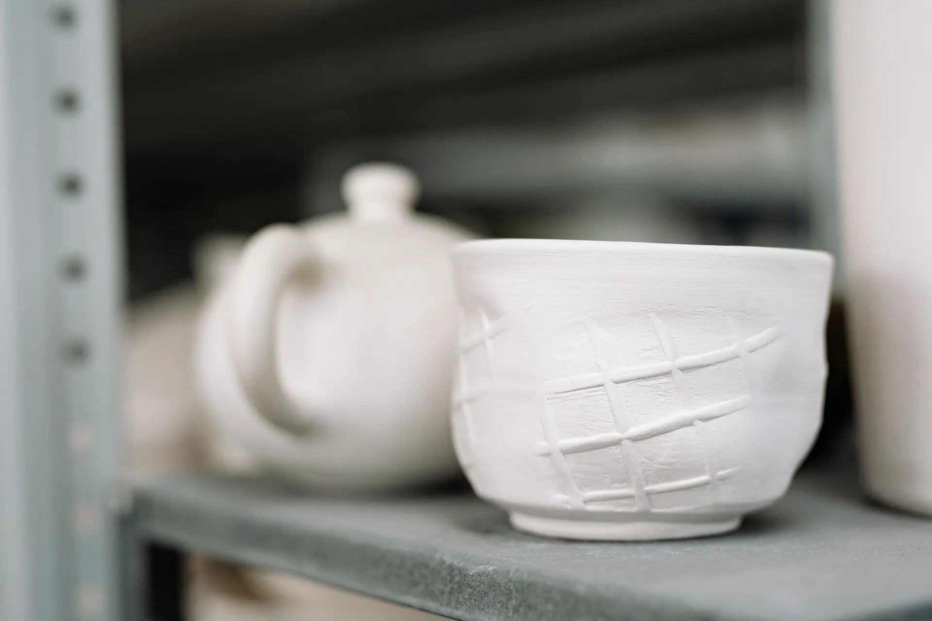 Detail of a textured porcelain vessel inspired by moonlit stone
