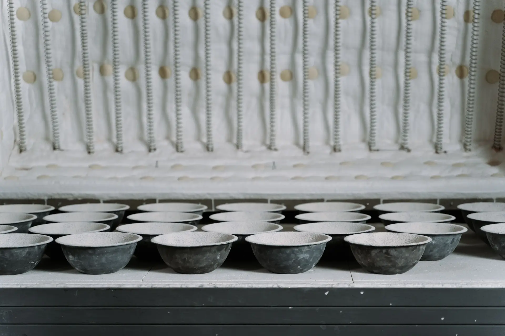 Ceramic bowls inside an open kiln