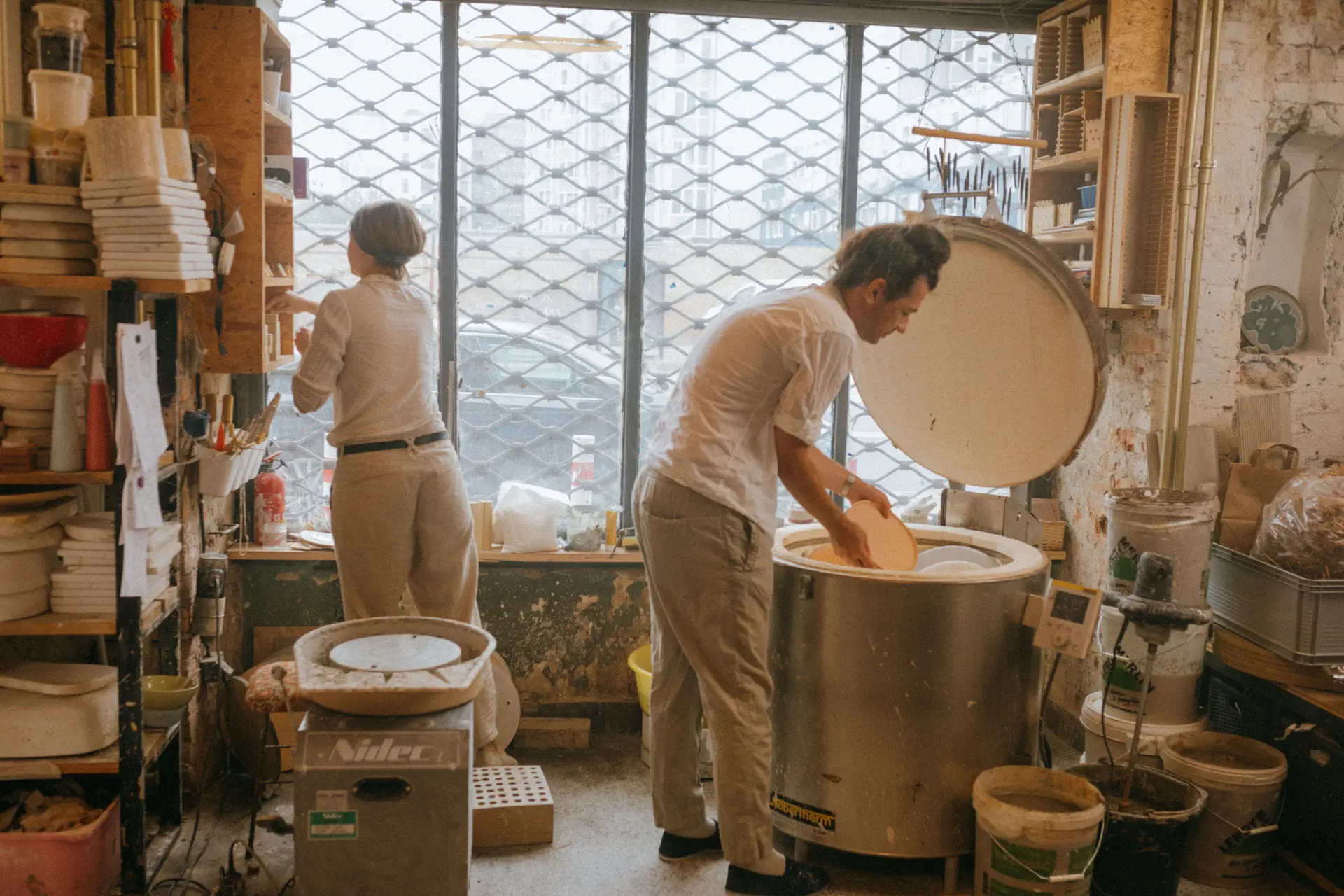 LunarivoryWorks studio atmosphere with soft lighting and ceramic forms